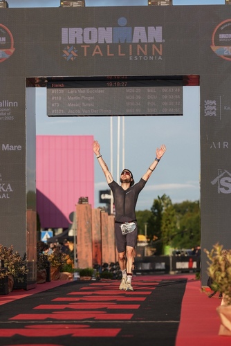 Dan Furze at the finish line of Ironman Tallin, 2025